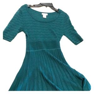 A dark green short sleeved dress made by Candies.